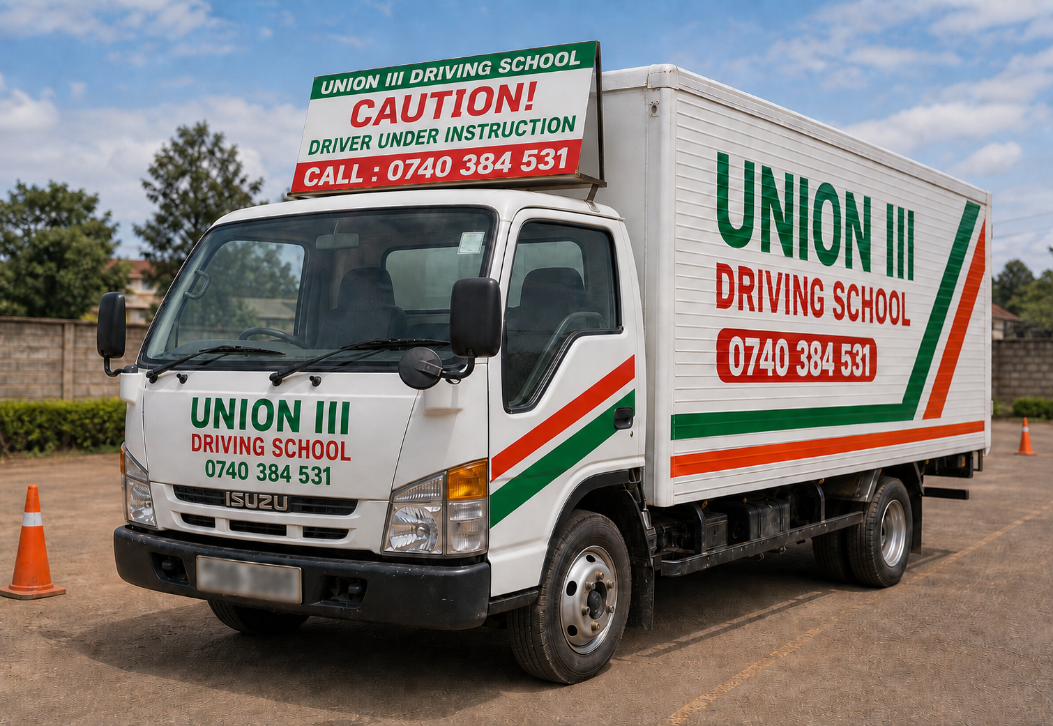 Union III branded lorry and light truck training vehicle with large caution roof banner and blurred number plate